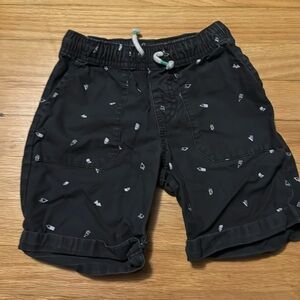 Dark grey shorts with white shape design